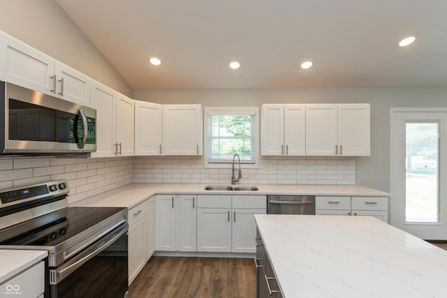 3204 N County Road 900 E, Seymour, IN 47274 - kitchen with stainless steel appliances, dark wood-style floors, white cabinetry, recessed lighting, and vaulted ceiling