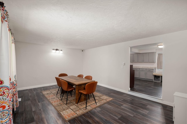 106 N Jamalee Way, Pendleton, IN 46064 - dining area with dark wood-type flooring, baseboards, and a textured ceiling