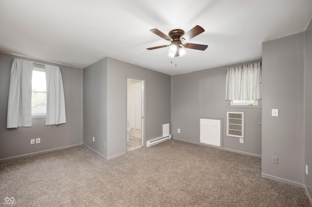 106 N Jamalee Way, Pendleton, IN 46064 - unfurnished room with a baseboard heating unit, ceiling fan, carpet flooring, and baseboards