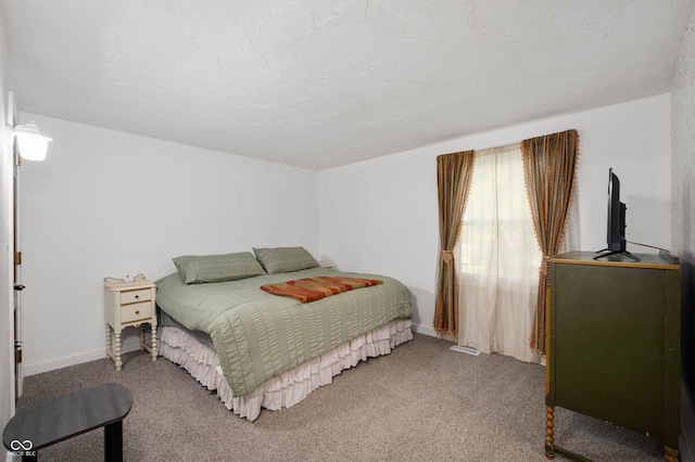 106 N Jamalee Way, Pendleton, IN 46064 - bedroom featuring a textured ceiling, carpet, and baseboards
