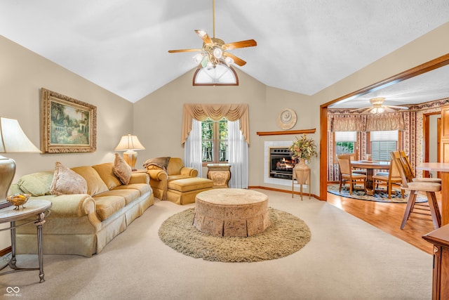 6605 N Private Road 110 W, Brazil, IN 47834 - living area featuring a ceiling fan, a fireplace, wood finished floors, and lofted ceiling