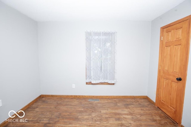 5840 N State Highway 7, Scipio, IN 47273 - spare room featuring wood finished floors and baseboards