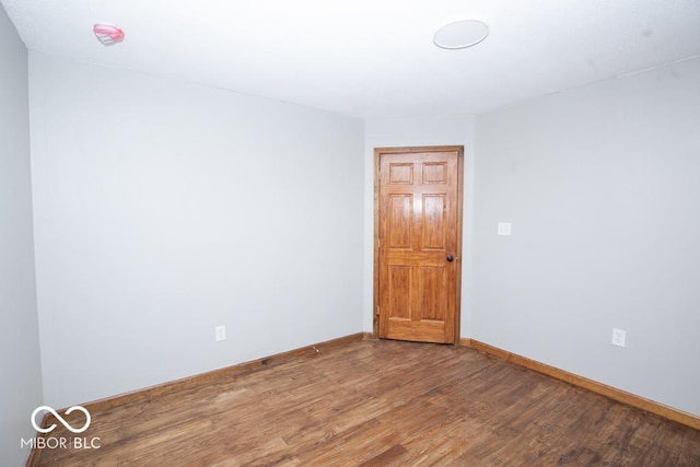 5840 N State Highway 7, Scipio, IN 47273 - spare room featuring wood finished floors and baseboards