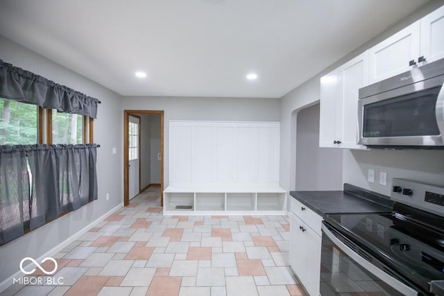 5840 N State Highway 7, Scipio, IN 47273 - kitchen with appliances with stainless steel finishes, white cabinets, recessed lighting, dark countertops, and baseboards
