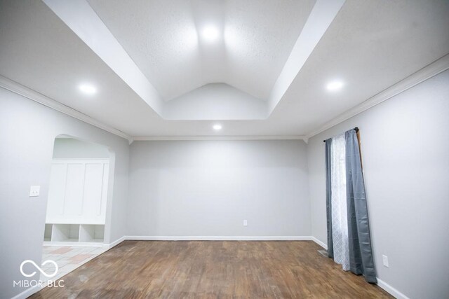5840 N State Highway 7, Scipio, IN 47273 - unfurnished room featuring wood finished floors, recessed lighting, baseboards, vaulted ceiling, and ornamental molding