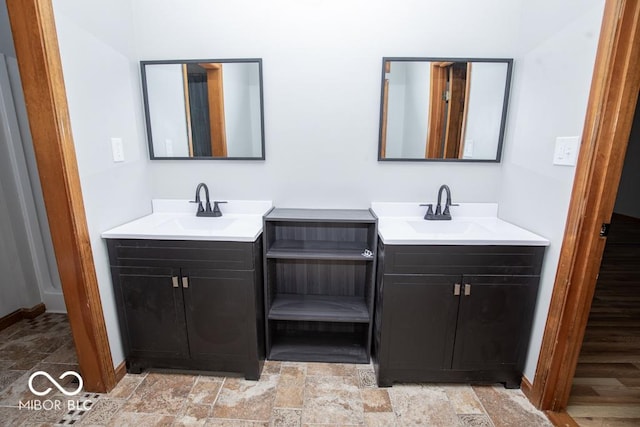 5840 N State Highway 7, Scipio, IN 47273 - full bathroom with two vanities, stone finish floors, and baseboards