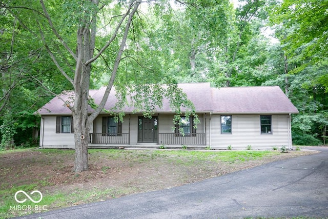 5840 N State Highway 7, Scipio, IN 47273 - ranch-style home with covered porch and roof with shingles