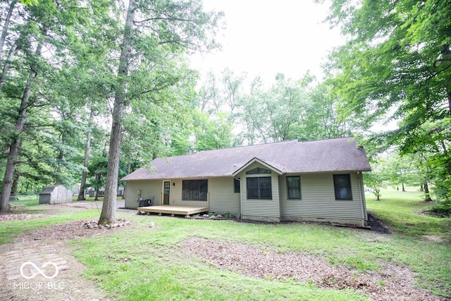 5840 N State Highway 7, Scipio, IN 47273 - single story home with a deck, a front yard, and central AC