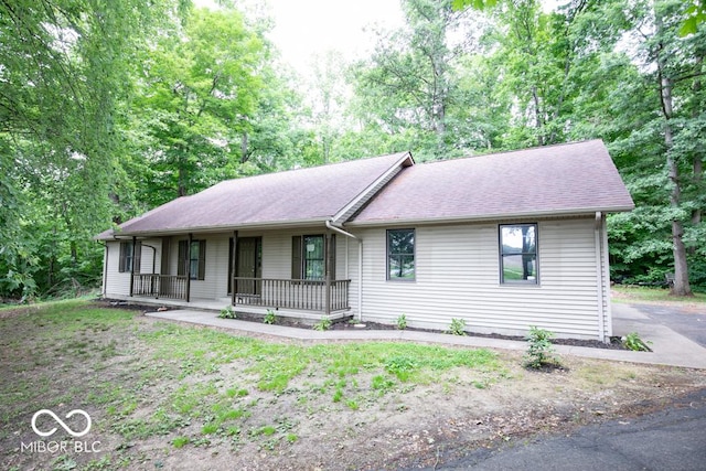 5840 N State Highway 7, Scipio, IN 47273 - single story home with covered porch and a shingled roof