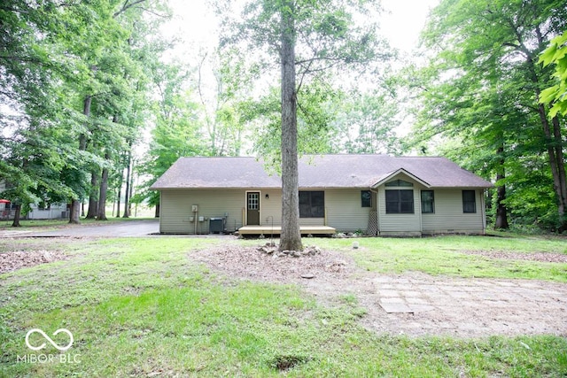 5840 N State Highway 7, Scipio, IN 47273 - view of front facade with cooling unit, a deck, and a front lawn