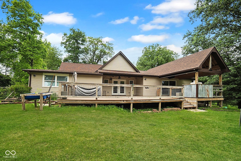 5116 W County Road 450 S, Coatesville, IN 46121 - back of house featuring a yard, a deck, and roof with shingles