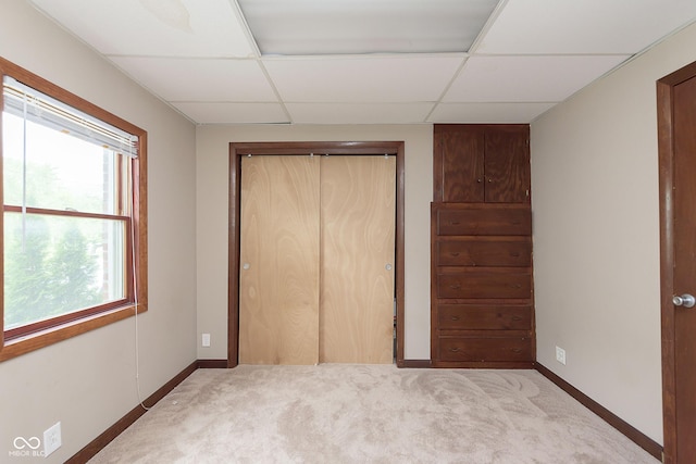 5110 S State Ave, Indianapolis, IN 46227 - unfurnished bedroom with light carpet, a closet, baseboards, and a drop ceiling