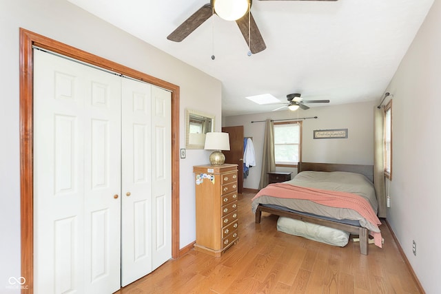 5110 S State Ave, Indianapolis, IN 46227 - bedroom featuring light wood finished floors, a closet, baseboards, and a skylight