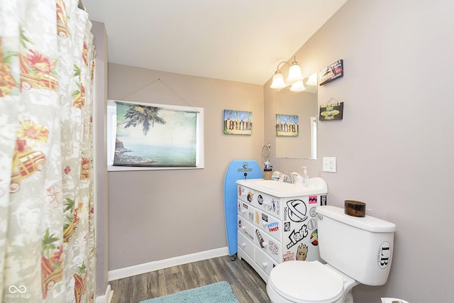 5110 S State Ave, Indianapolis, IN 46227 - bathroom with wood finished floors, toilet, vanity, and baseboards