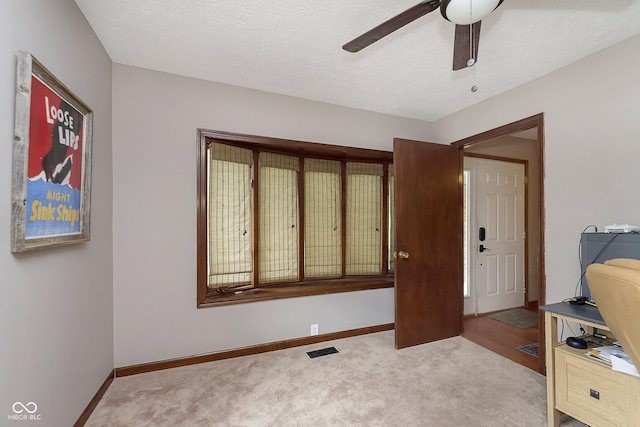 5110 S State Ave, Indianapolis, IN 46227 - carpeted entryway featuring ceiling fan, baseboards, and a textured ceiling