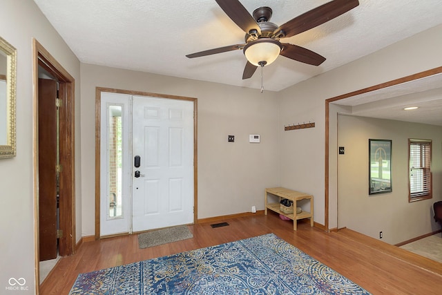 5110 S State Ave, Indianapolis, IN 46227 - entryway with light wood-style floors, ceiling fan, baseboards, and a textured ceiling