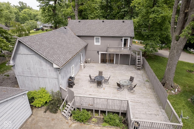 5110 S State Ave, Indianapolis, IN 46227 - back of house with stairway, a wooden deck, roof with shingles, outdoor dining area, and a chimney