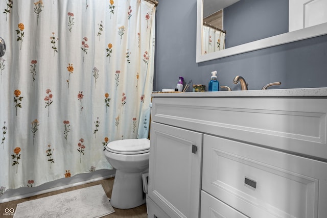 1529 E Tabor St, Indianapolis, IN 46203 - full bath with vanity, toilet, wood finished floors, and a shower with curtain