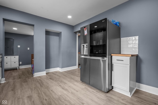 1529 E Tabor St, Indianapolis, IN 46203 - kitchen featuring stainless steel refrigerator with ice dispenser, light wood-type flooring, baseboards, electric panel, and recessed lighting