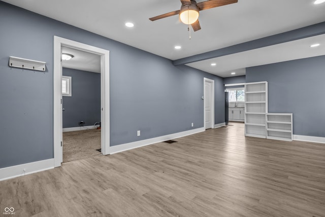 1529 E Tabor St, Indianapolis, IN 46203 - unfurnished living room with a ceiling fan, wood finished floors, recessed lighting, and baseboards