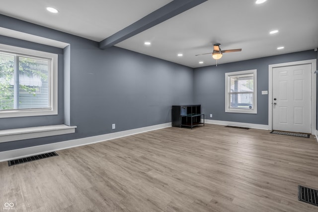 1529 E Tabor St, Indianapolis, IN 46203 - unfurnished living room with wood finished floors, ceiling fan, recessed lighting, and baseboards