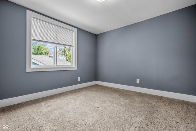 1529 E Tabor St, Indianapolis, IN 46203 - carpeted empty room with baseboards