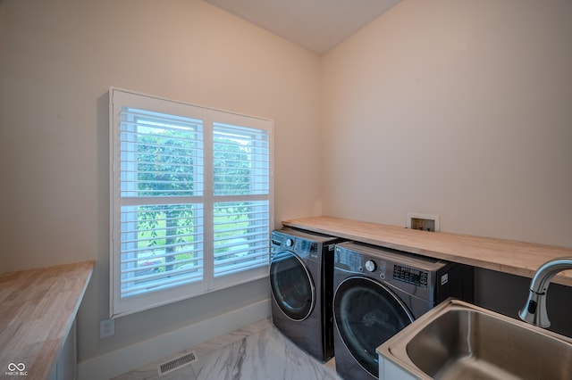 8703 Gordonshire Dr, Indianapolis, IN 46278 - laundry area featuring washing machine and clothes dryer and marble look tiles