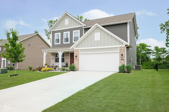 5335 Rum Cherry Way, Indianapolis, IN 46237 - craftsman-style home featuring board and batten siding, a porch, a front lawn, and driveway