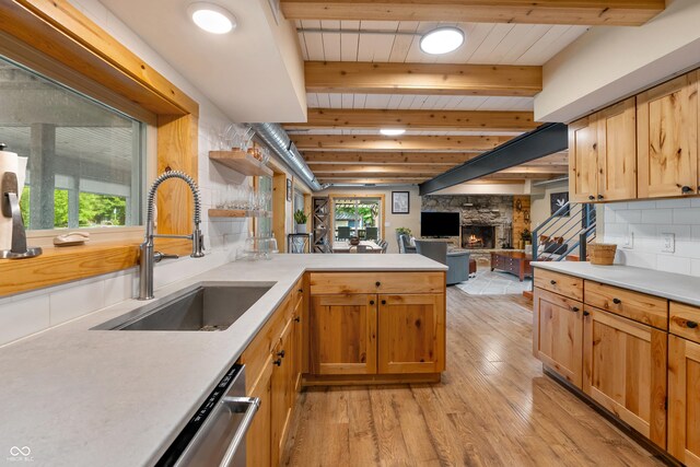 8426 N Chickadee Dr, Morgantown, IN 46160 - kitchen with a sink, light wood-style floors, a fireplace, a peninsula, and open shelves