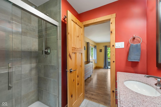 8426 N Chickadee Dr, Morgantown, IN 46160 - full bathroom featuring a stall shower, wood finished floors, and vanity