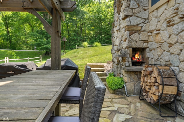 8426 N Chickadee Dr, Morgantown, IN 46160 - view of patio with an outdoor stone fireplace