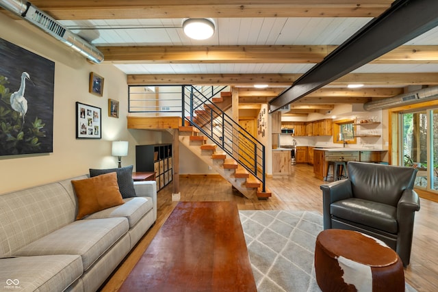 8426 N Chickadee Dr, Morgantown, IN 46160 - living room with light wood-style floors, stairs, and beamed ceiling
