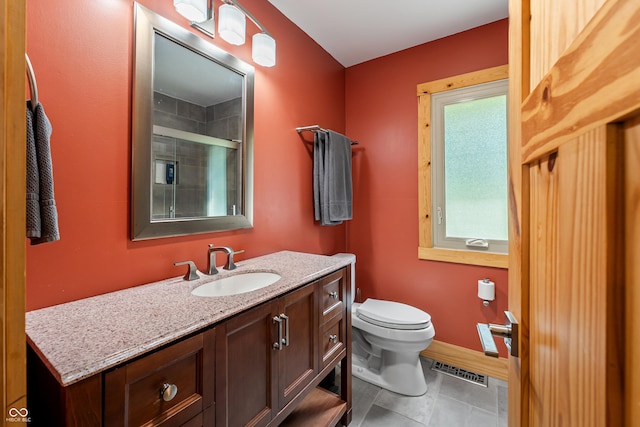 8426 N Chickadee Dr, Morgantown, IN 46160 - full bathroom featuring toilet, vanity, a shower with shower door, baseboards, and tile patterned flooring