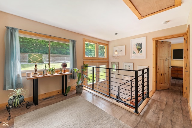 8426 N Chickadee Dr, Morgantown, IN 46160 - corridor with wood finished floors, an upstairs landing, and baseboards