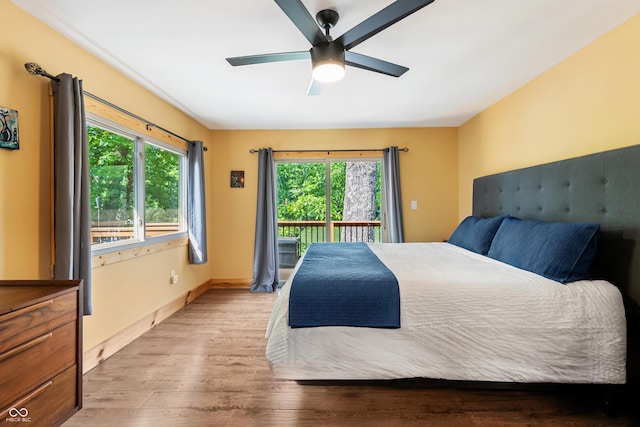 8426 N Chickadee Dr, Morgantown, IN 46160 - bedroom with access to outside, light wood-style flooring, ceiling fan, and baseboards