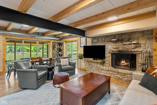 8426 N Chickadee Dr, Morgantown, IN 46160 - living room featuring a fireplace, wood finished floors, and beamed ceiling