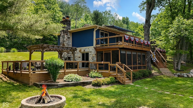 8426 N Chickadee Dr, Morgantown, IN 46160 - back of house with a sunroom, a fire pit, a pergola, a wooden deck, and stairway