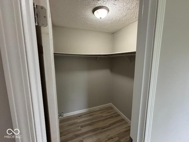 724 Iroquois St, Anderson, IN 46012 - walk in closet featuring wood finished floors