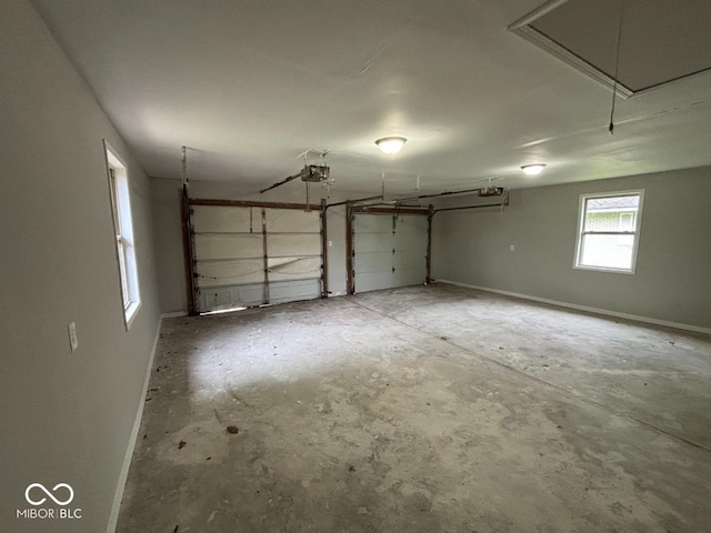 724 Iroquois St, Anderson, IN 46012 - garage featuring a garage door opener and baseboards