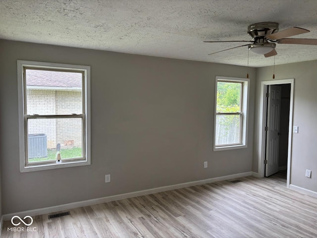 724 Iroquois St, Anderson, IN 46012 - empty room with ceiling fan, light wood-style floors, a textured ceiling, and baseboards