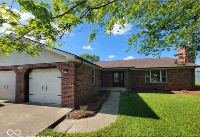 724 Iroquois St, Anderson, IN 46012 - single story home with a front lawn, a chimney, an attached garage, brick siding, and driveway
