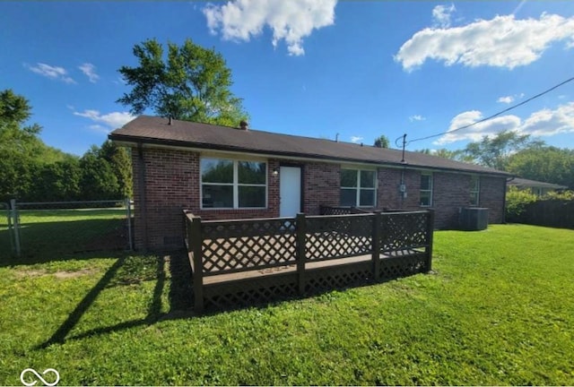 724 Iroquois St, Anderson, IN 46012 - rear view of house featuring brick siding, a deck, and central AC