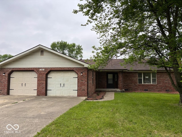 724 Iroquois St, Anderson, IN 46012 - single story home with a garage, driveway, a front lawn, and brick siding