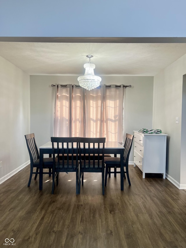 7532 Perilla Ct, Indianapolis, IN 46237 - dining room featuring dark wood-style flooring, baseboards, and a chandelier