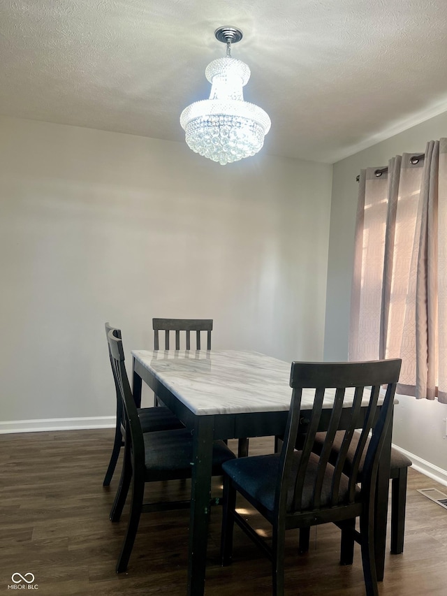 7532 Perilla Ct, Indianapolis, IN 46237 - dining room with a chandelier, wood finished floors, baseboards, and a textured ceiling