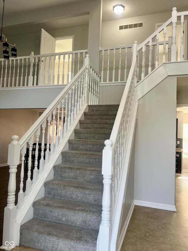 7532 Perilla Ct, Indianapolis, IN 46237 - stairway with baseboards and a towering ceiling