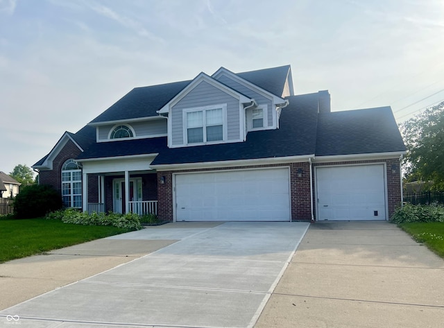7532 Perilla Ct, Indianapolis, IN 46237 - view of front of house with driveway, brick siding, a garage, and a shingled roof