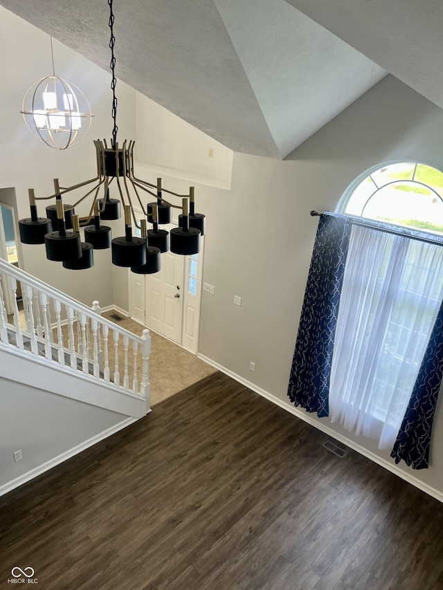 7532 Perilla Ct, Indianapolis, IN 46237 - living room with wood finished floors, vaulted ceiling, a chandelier, and baseboards