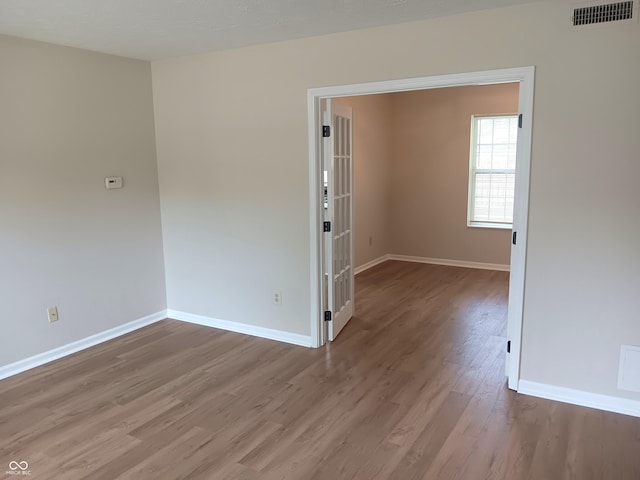 18851 Wimbley Way, Noblesville, IN 46060 - empty room with wood finished floors and baseboards