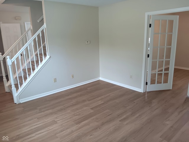 18851 Wimbley Way, Noblesville, IN 46060 - empty room featuring wood finished floors and stairs